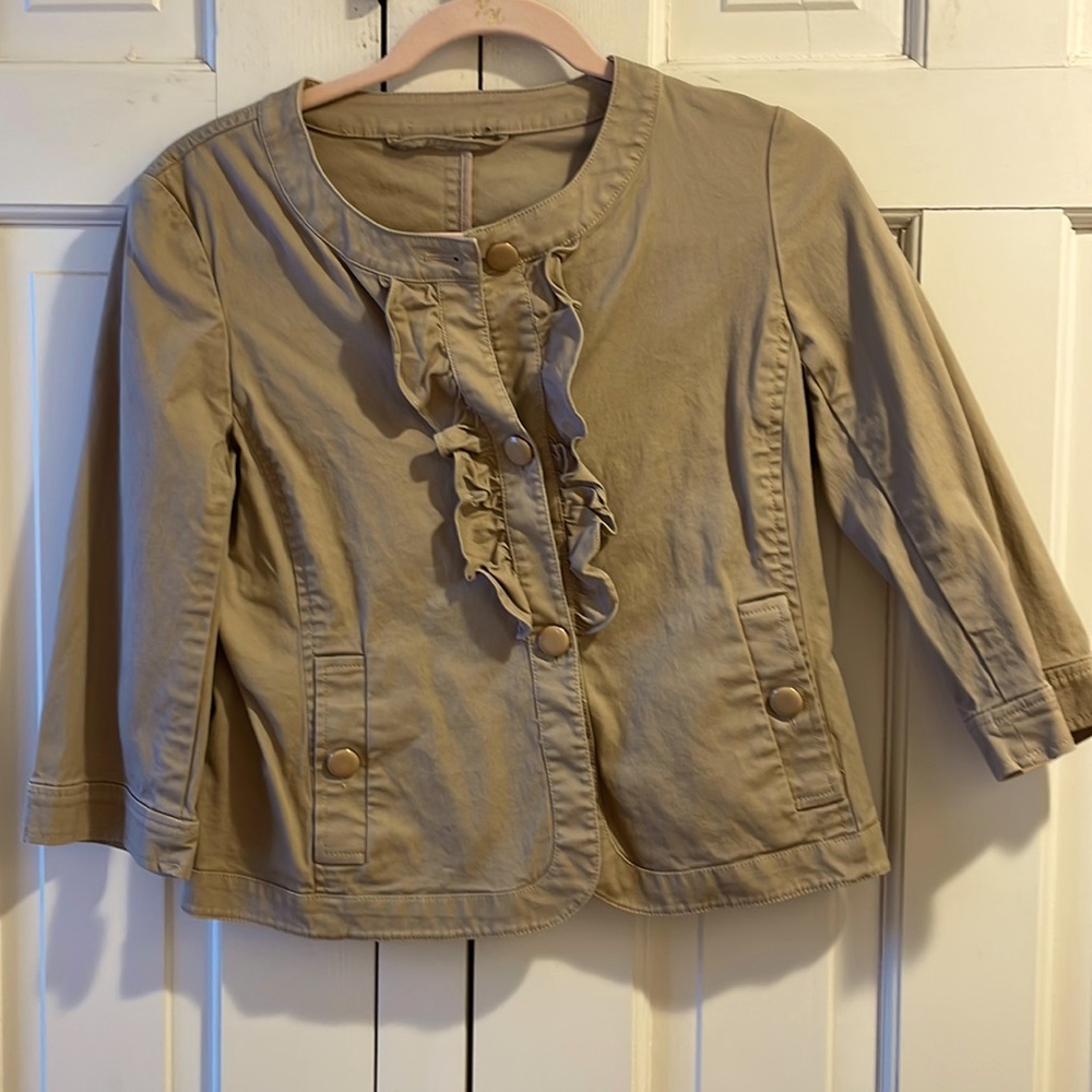 Khaki colored jacket. Fashioned like a jean jacket